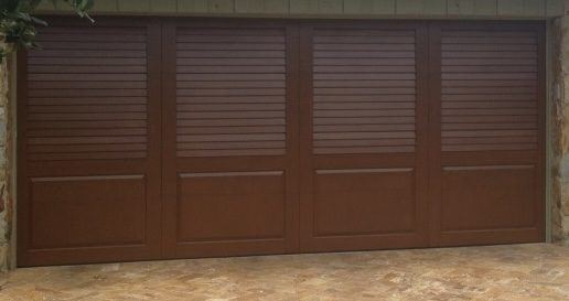 Custom garage door with louvered upper panels